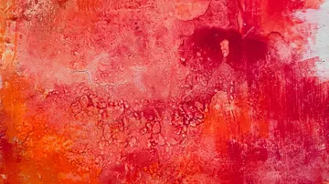Abstract painting with red and orange textures.
