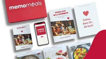 Meal kit contents with phone and cards.