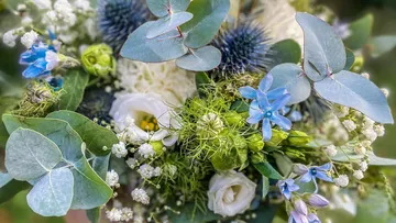 Colourful flowers and leaves arranged in a lovely bouquet.