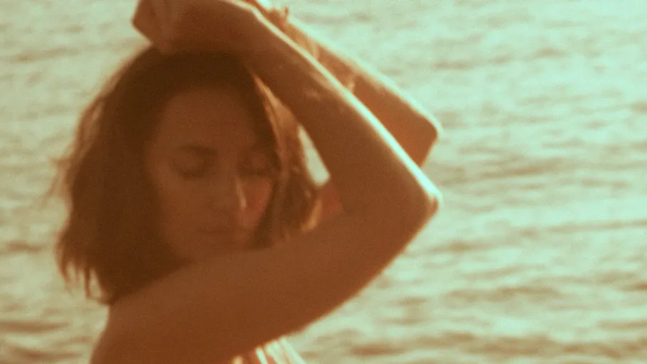 Person by the sea in soft focus.