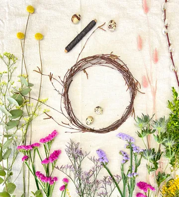 Floral wreath supplies arranged on a table.