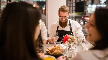 People dining at a restaurant table.