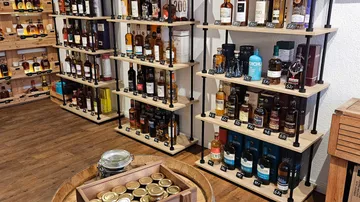 Shelves of whiskey bottles in a store.