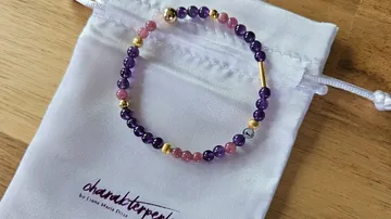 Beaded bracelet on a white pouch.