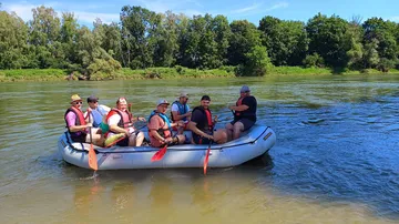 Group rafting on a calm river.