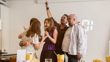 Group of people celebrating indoors.
