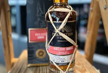 Bottle of Belize 2015 rum on shelf.
