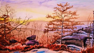 Bäume und Felsen bei Sonnenuntergang im Herbstlandschaft.