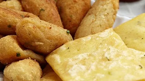 Assorted fried Colombian appetizers on a plate.