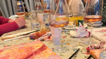 Wine glasses on table with painting activity.