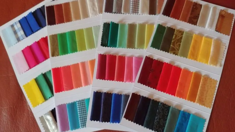 Colorful fabric swatches displayed in rows.