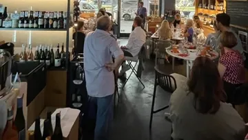 People seated at tables in a restaurant.