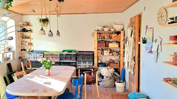 Cozy dining room with rustic wooden table.