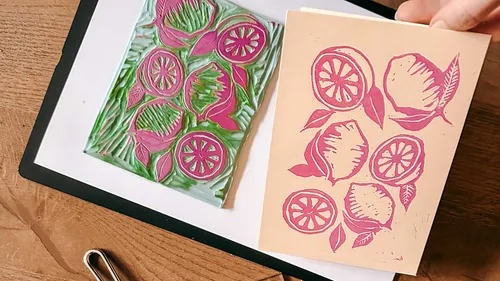 Lino block print of citrus on paper.