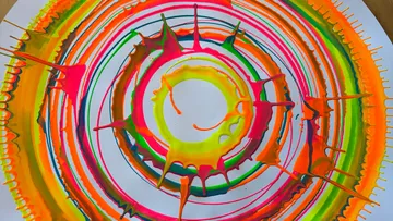 Colorful spiral pattern with splatter effect.