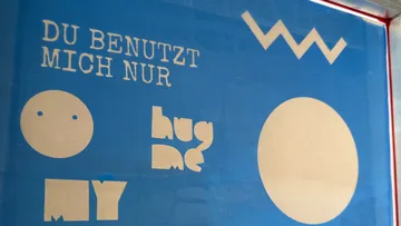 Text and shapes on a blue background.
