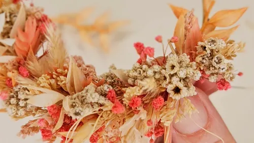 Dried flower arrangement held in hand.