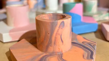 Colorful, abstract candle holders on a table.