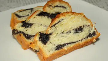 Slices of poppy seed cake on white plate.