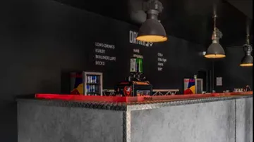 Bar counter with industrial-style lamps.