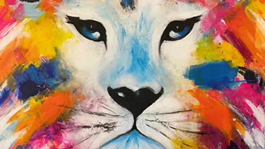 Colorful lion face painting with blue eyes.