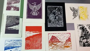 Colorful abstract prints arranged on a table.