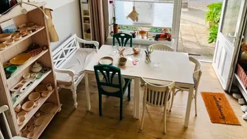 Dining table with chairs in cozy room.