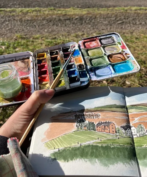 Hand malt Landschaft mit Aquarellset im Freien.