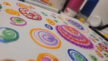 Colorful spirals drawn with markers on paper.