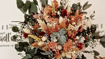 Colorful dried floral bouquet with eucalyptus.