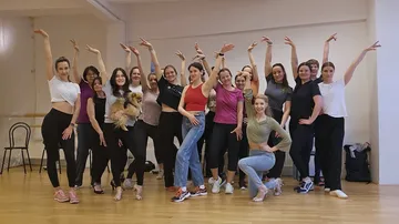 Group of women posing in dance studio.