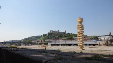 Jenga tower with castle in background.