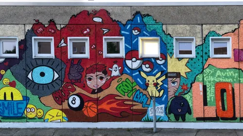 Colorful mural with cartoon characters and symbols.