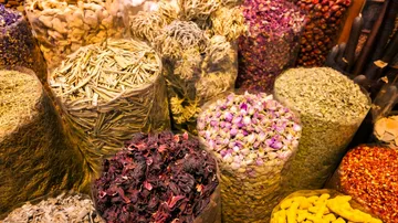 Assorted dried spices displayed in sacks.
