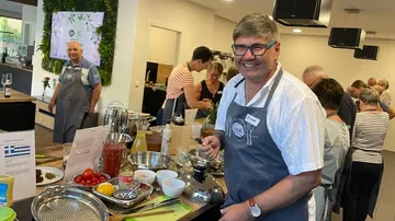People cooking in a busy kitchen.
