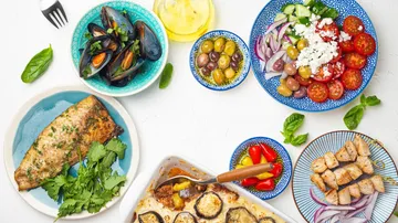 Mediterranean dishes with seafood and vegetables.