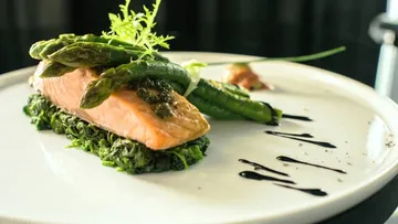 Salmon and asparagus on a white plate.