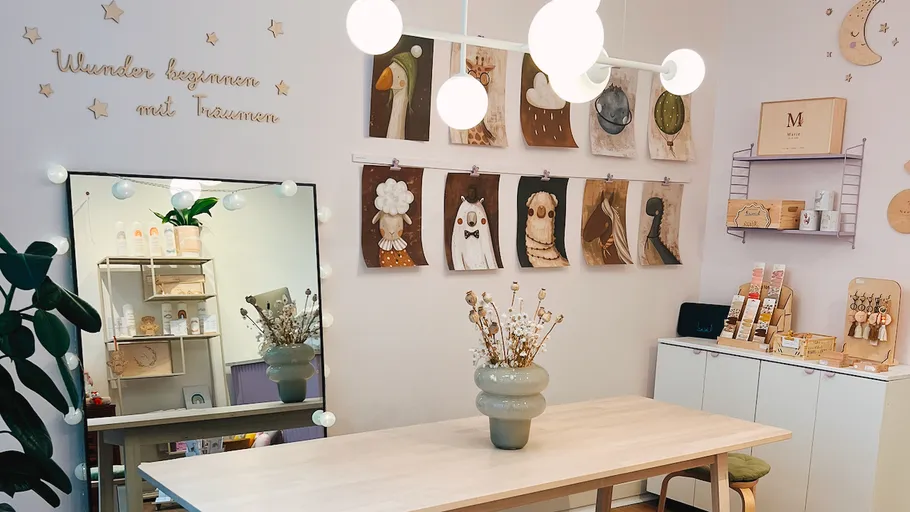 Cozy room with table, mirror, and wall art.