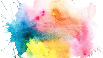 Bunte Aquarellspritzer auf weißem Hintergrund.