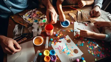 Children and adults crafting with colorful materials.