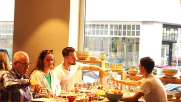 Group dining at a table in a restaurant.