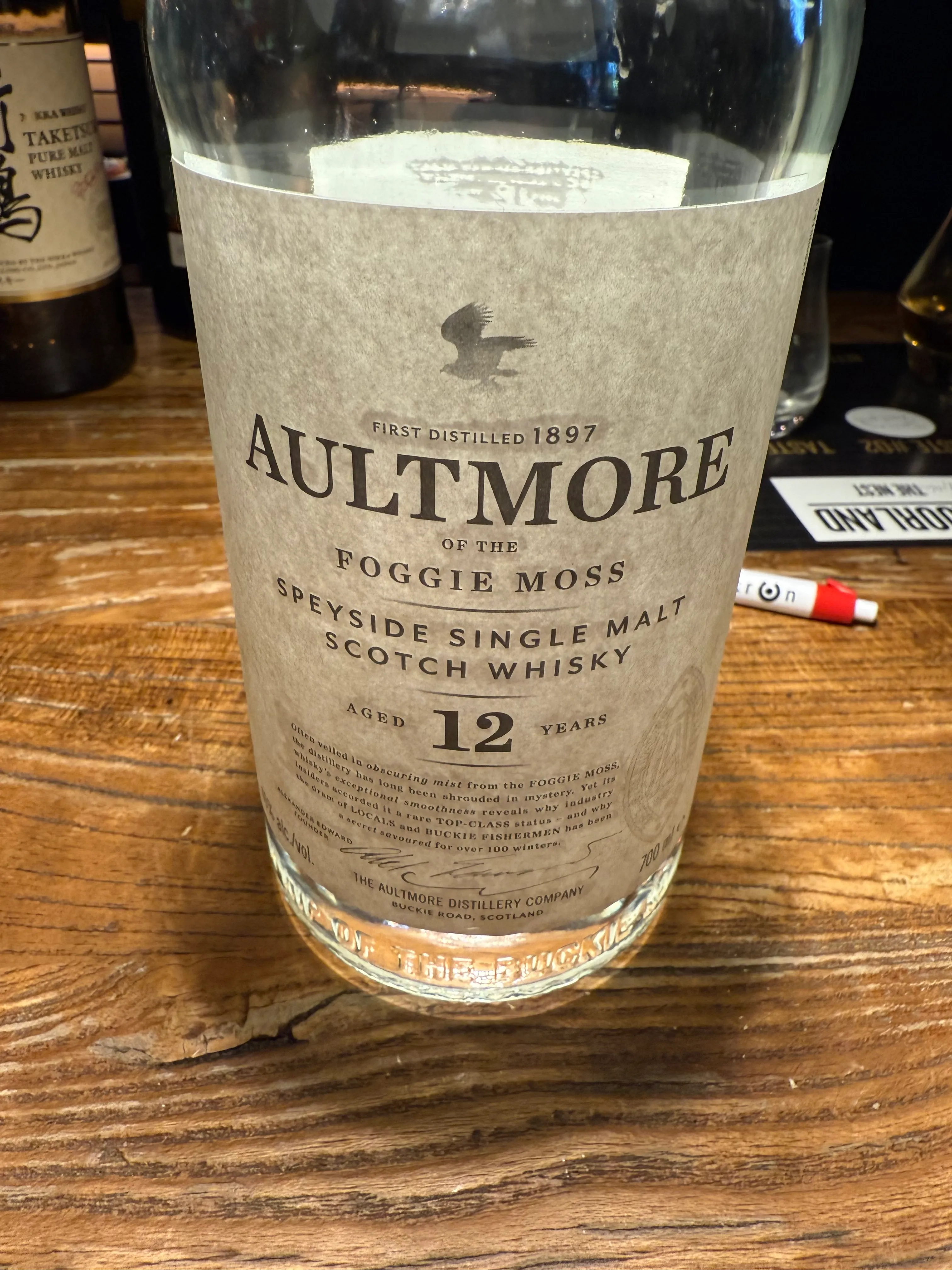 Whisky bottle on a wooden table.