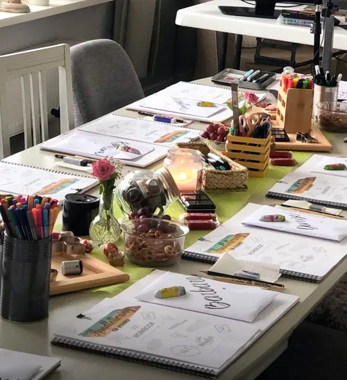 Art supplies on a table for class.