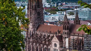 Historic cathedral with city in background.