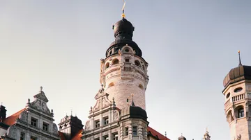 Tall stone tower with decorative spires.