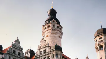 Historical building with tower against sky.