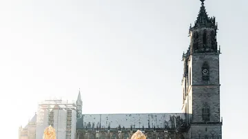 Cathedral in winter sunlight, snow on roof.