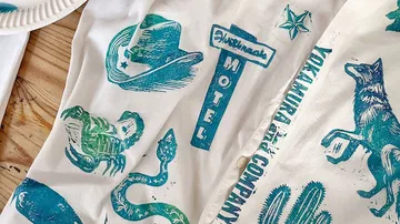 Shirt with blue western-themed prints.