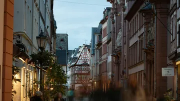 Narrow street with traditional half-timbered houses.