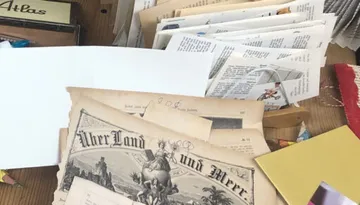 Old documents and papers on a table.